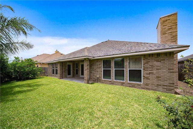 2602 Windhollow Dr, Corpus Christi, TX 78414 - rear view of property with a chimney, a patio area, and brick siding