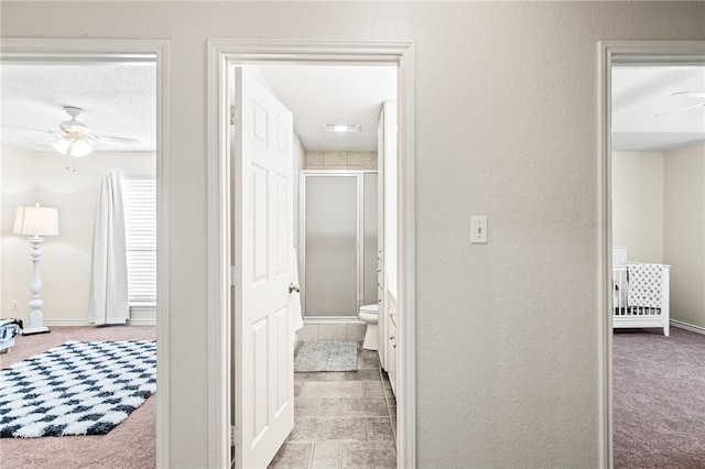 13853 Topsail St, Corpus Christi, TX 78418 - corridor featuring carpet floors and a textured wall