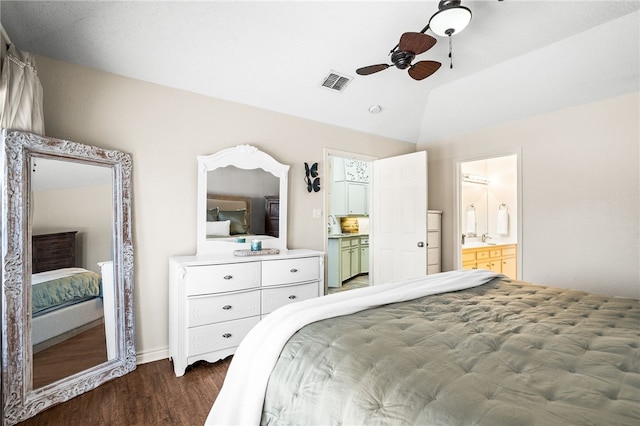 13853 Topsail St, Corpus Christi, TX 78418 - bedroom featuring dark wood finished floors, vaulted ceiling, ensuite bathroom, and a ceiling fan