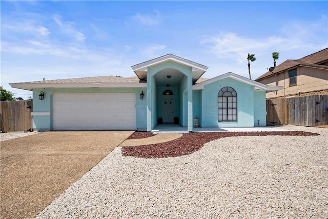 13853 Topsail St, Corpus Christi, TX 78418 - single story home featuring stucco siding, a garage, and driveway