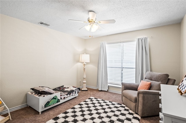13853 Topsail St, Corpus Christi, TX 78418 - bedroom with multiple windows, carpet flooring, a ceiling fan, and a textured ceiling