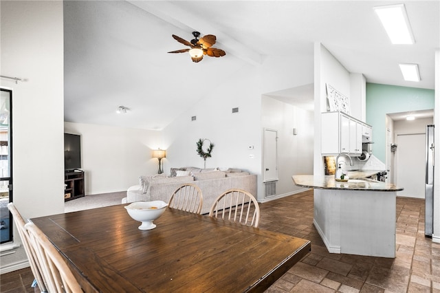 13853 Topsail St, Corpus Christi, TX 78418 - dining room featuring ceiling fan, beam ceiling, and high vaulted ceiling