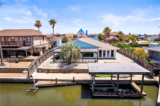 13853 Topsail St, Corpus Christi, TX 78418 - dock featuring a residential view, boat lift, a water view, and a fenced backyard