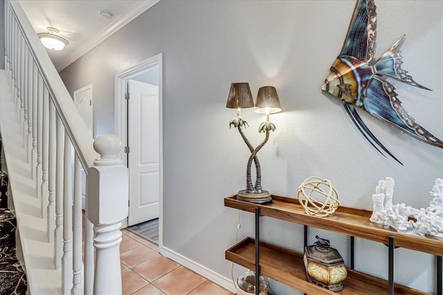14901 Windward Dr Unit 204, Corpus Christi, TX 78418 - hallway featuring light tile patterned flooring, crown molding, and stairs