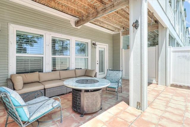 14901 Windward Dr Unit 204, Corpus Christi, TX 78418 - view of patio / terrace with an outdoor living space with a fire pit and fence