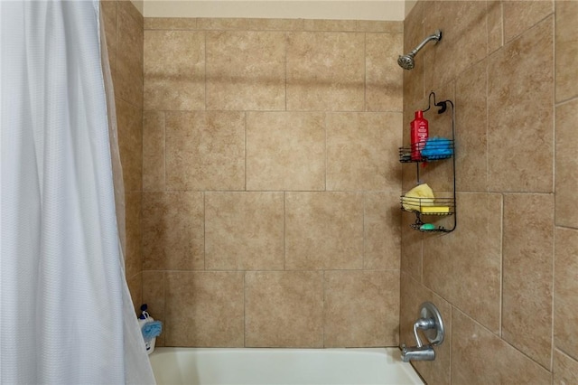 bathroom with shower / bathtub combination with curtain