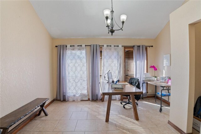 tiled home office with an inviting chandelier