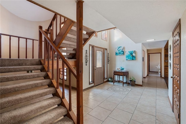 foyer featuring light tile patterned floors