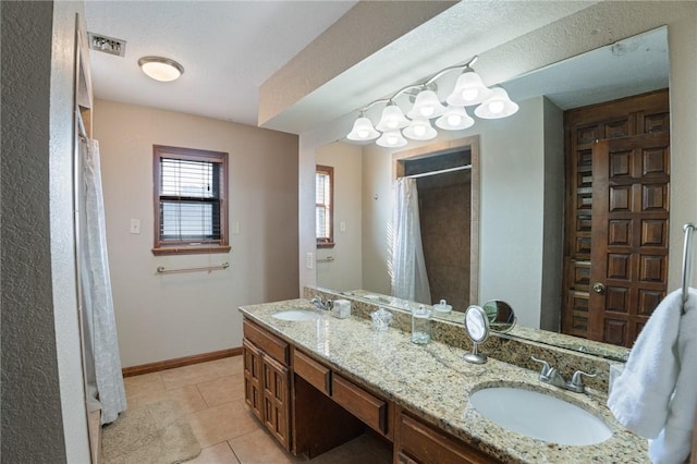 bathroom featuring vanity and tile patterned flooring