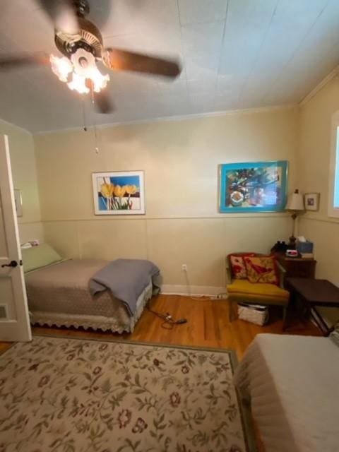 25006 Tuckers Trl, Mathis, TX 78368 - bedroom featuring wood finished floors, ornamental molding, and a ceiling fan