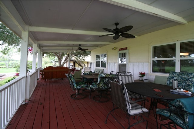 wooden deck featuring ceiling fan