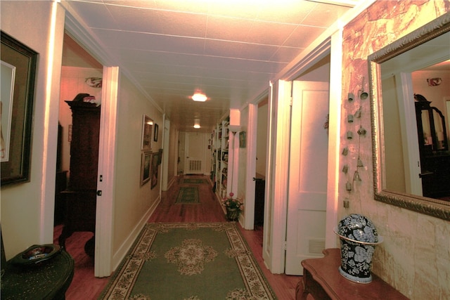 hallway with hardwood / wood-style flooring