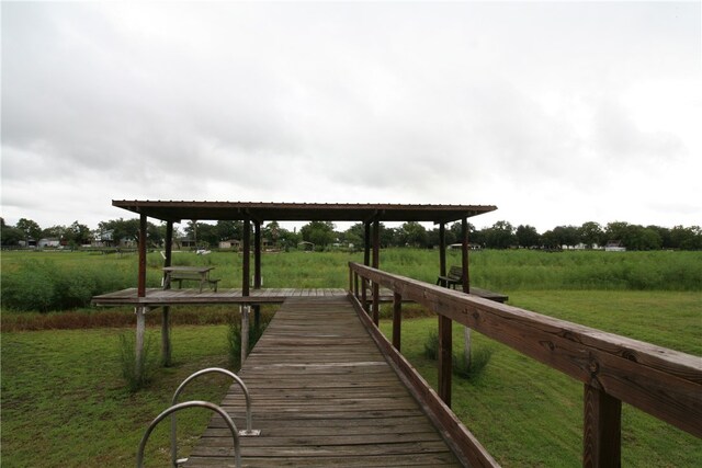 dock area featuring a lawn