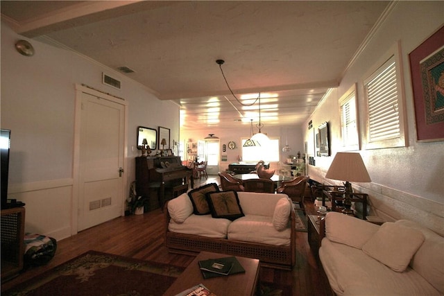 25006 Tuckers Trl, Mathis, TX 78368 - living room featuring wood finished floors, crown molding, and wainscoting