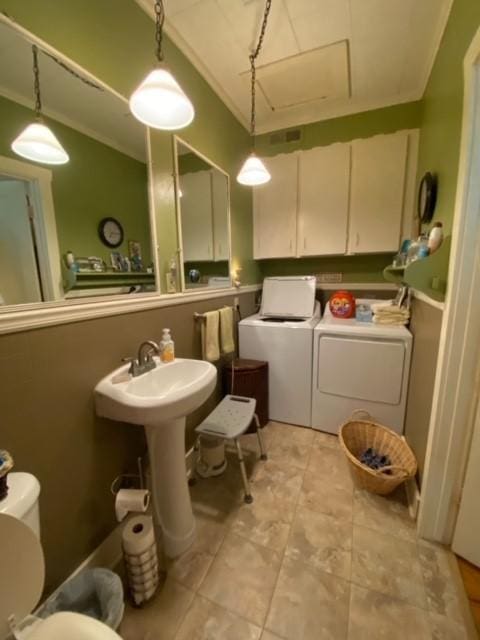 25006 Tuckers Trl, Mathis, TX 78368 - half bath featuring washer and dryer, a sink, and toilet