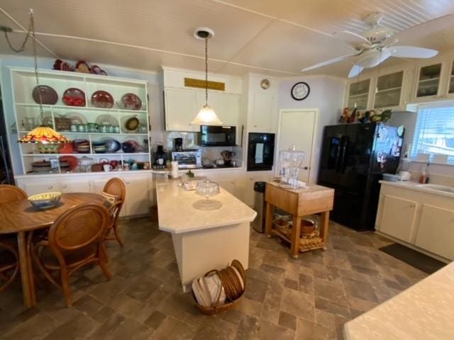 25006 Tuckers Trl, Mathis, TX 78368 - kitchen featuring black appliances, white cabinets, light countertops, a ceiling fan, and hanging light fixtures