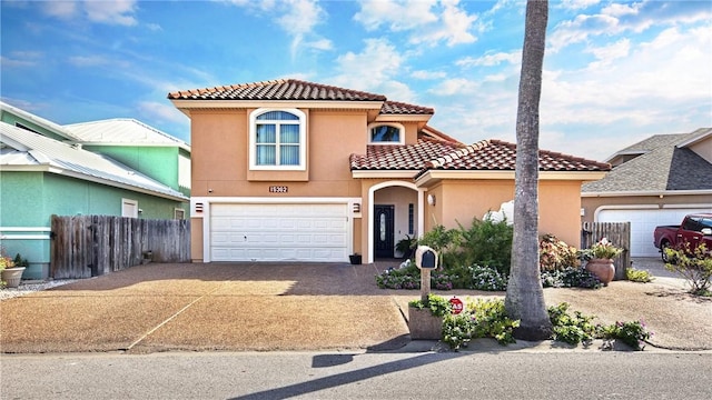15362 Isabella Ct, Corpus Christi, TX 78418 - view of front of property featuring driveway, a tiled roof, stucco siding, and a garage