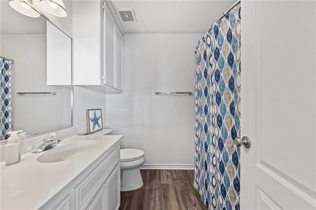15362 Isabella Ct, Corpus Christi, TX 78418 - bathroom with vanity, wood finished floors, and curtained shower