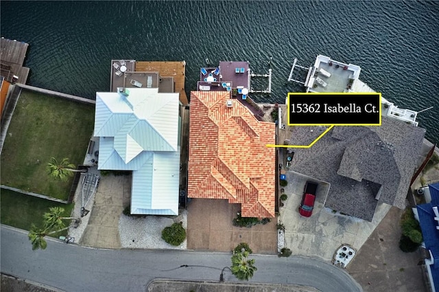 birds eye view of property with a water view