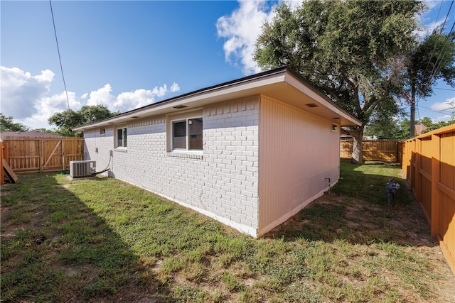 view of property exterior featuring a yard and cooling unit