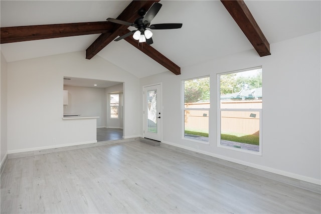 unfurnished living room featuring light hardwood / wood-style floors, ceiling fan, and lofted ceiling with beams