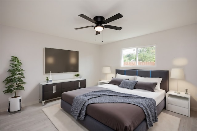 bedroom featuring light hardwood / wood-style flooring and ceiling fan