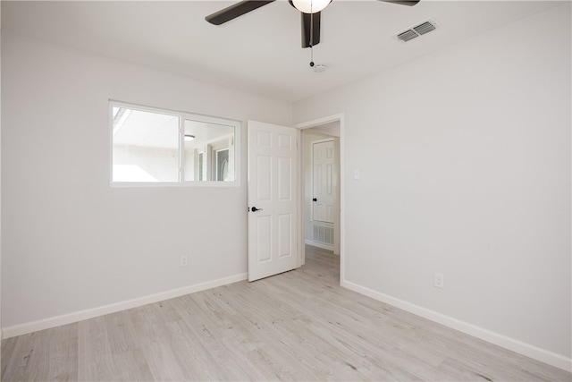 empty room with light wood-type flooring and ceiling fan