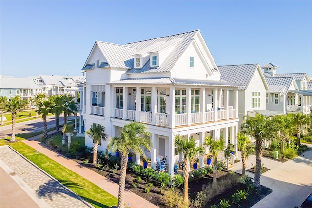 rear view of property featuring a balcony