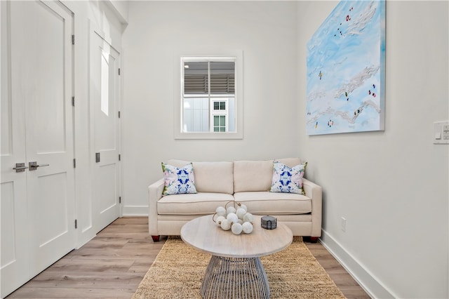 sitting room with light hardwood / wood-style floors