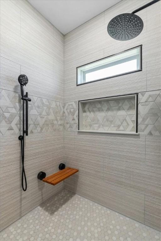 full bathroom with a tile shower