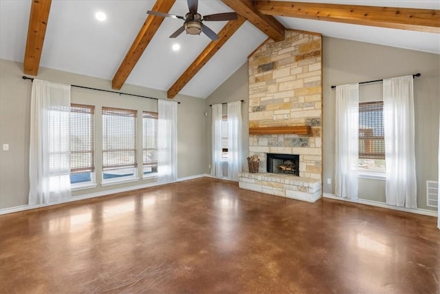 unfurnished living room featuring beamed ceiling, high vaulted ceiling, a stone fireplace, concrete flooring, and ceiling fan