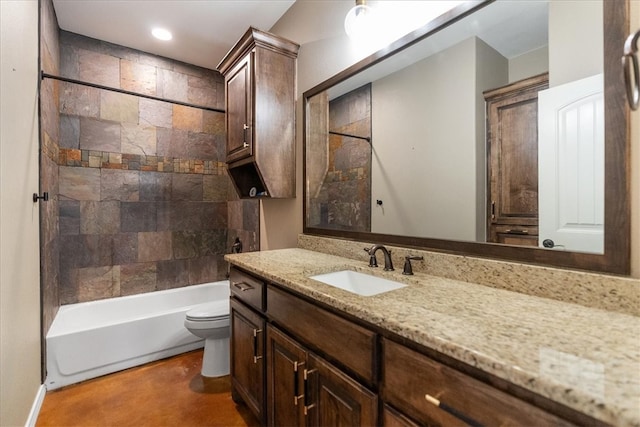 bathroom featuring toilet,  shower combination, and vanity