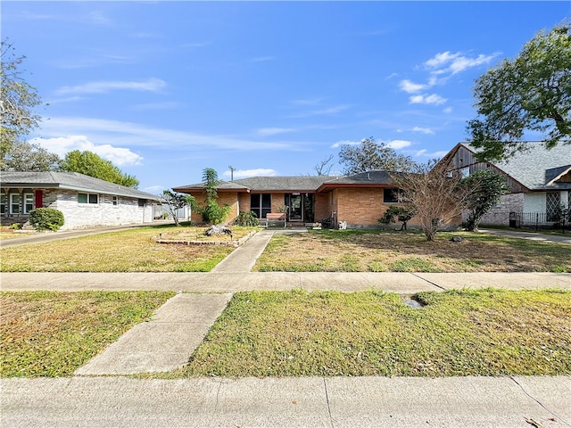 single story home with a front yard