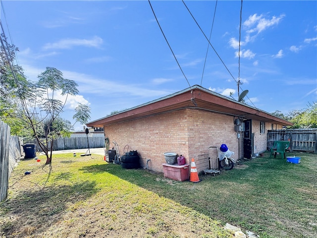 view of property exterior featuring a lawn