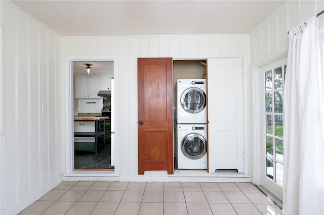 909 Cunningham St, Corpus Christi, TX 78411 - laundry room with estacked washer and dryer and light tile patterned floors