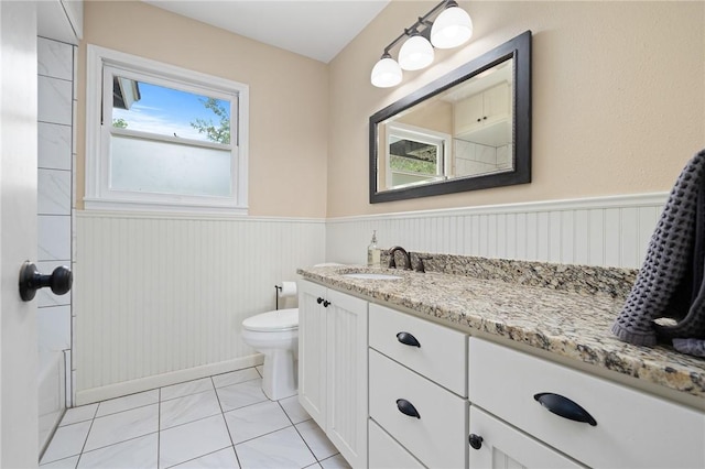 909 Cunningham St, Corpus Christi, TX 78411 - bathroom with vanity, a wainscoted wall, toilet, and shower / bath combination