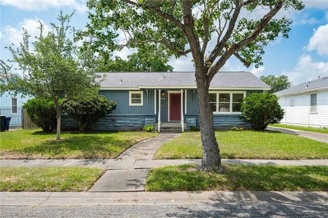 909 Cunningham St, Corpus Christi, TX 78411 - single story home featuring a shingled roof and stone siding