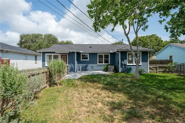 909 Cunningham St, Corpus Christi, TX 78411 - rear view of property featuring central AC and a patio