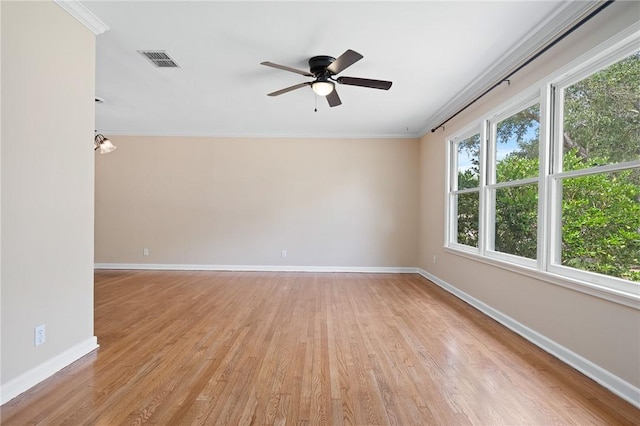 909 Cunningham St, Corpus Christi, TX 78411 - spare room featuring baseboards, light wood finished floors, ornamental molding, and ceiling fan