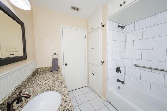 909 Cunningham St, Corpus Christi, TX 78411 - full bath with vanity, shower / bathtub combination, and tile patterned flooring