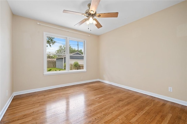909 Cunningham St, Corpus Christi, TX 78411 - empty room featuring light wood-style floors, baseboards, and ceiling fan