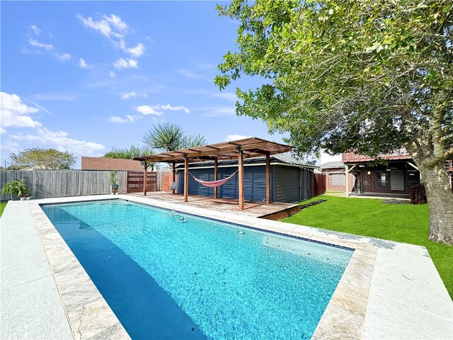 view of swimming pool with a pergola and a lawn