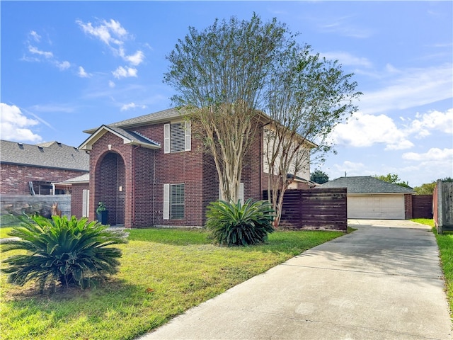 view of front of house featuring a front lawn and a garage