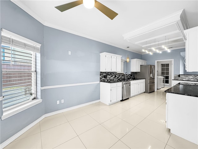 kitchen featuring white cabinetry, sink, crown molding, decorative backsplash, and appliances with stainless steel finishes