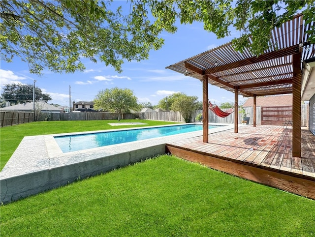 view of pool featuring a lawn, a pergola, and a wooden deck