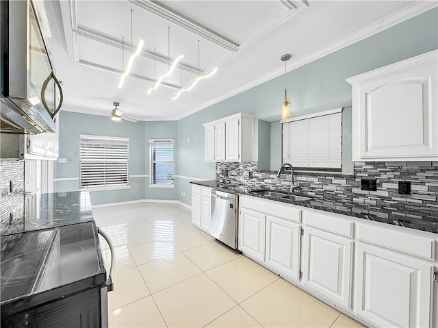 kitchen with backsplash, sink, light tile patterned floors, appliances with stainless steel finishes, and white cabinetry