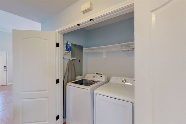 clothes washing area with light tile patterned floors and independent washer and dryer