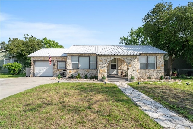 ranch-style home featuring stone siding, metal roof, and a garage