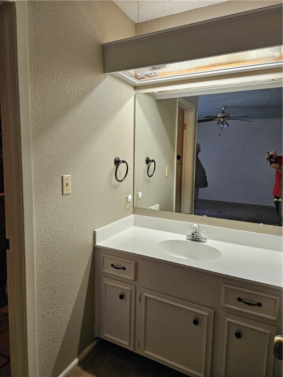 bathroom with vanity and ceiling fan