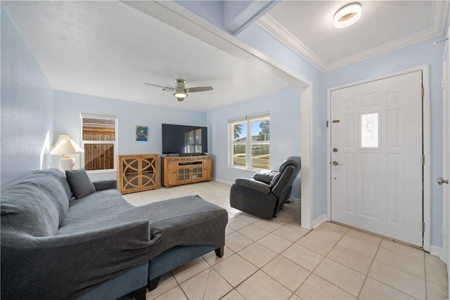 tiled living room with ceiling fan and crown molding